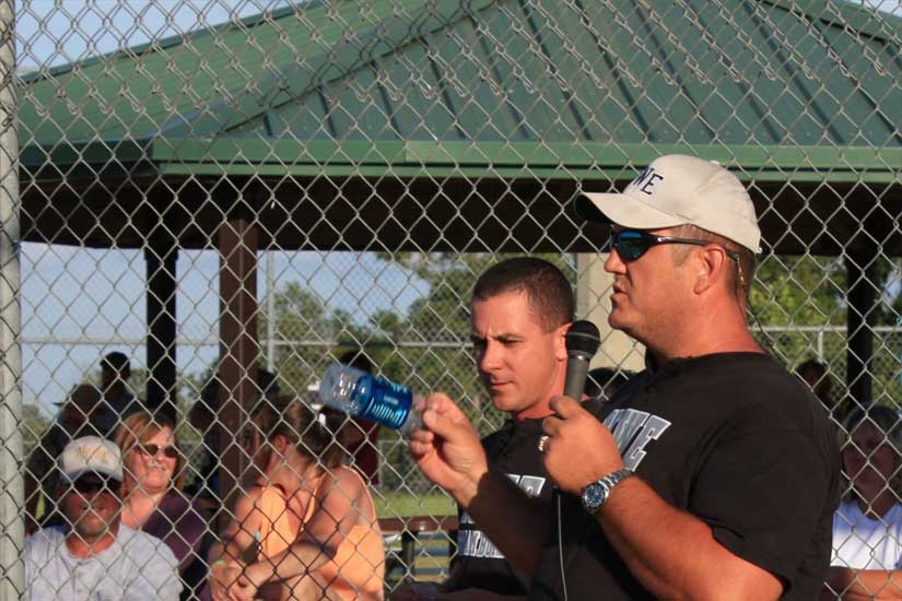 David Preston passes out pins to the Hammer Heads