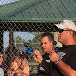 David Preston passes out pins to the Hammer Heads