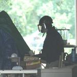 Bomb Technician Holds Container