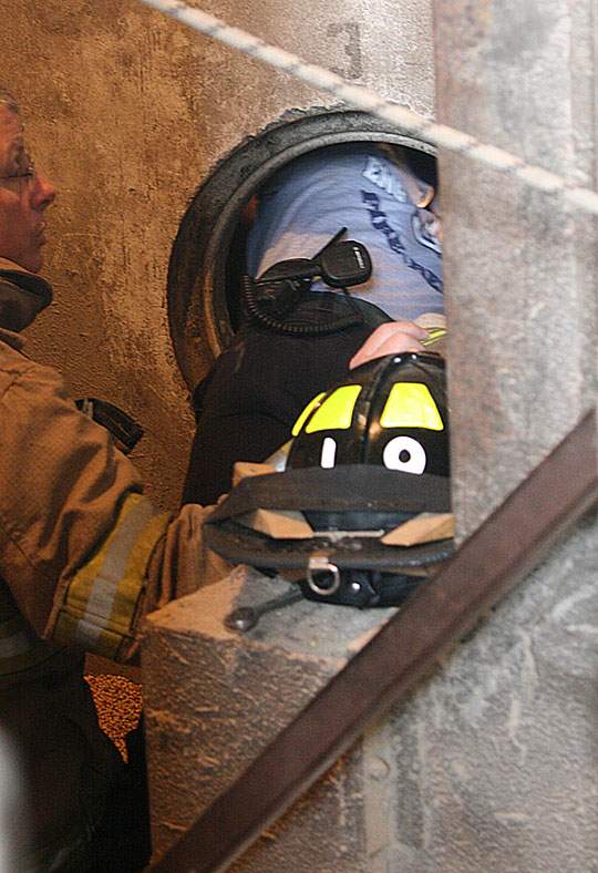 Rescuers Work Inside Access Hole