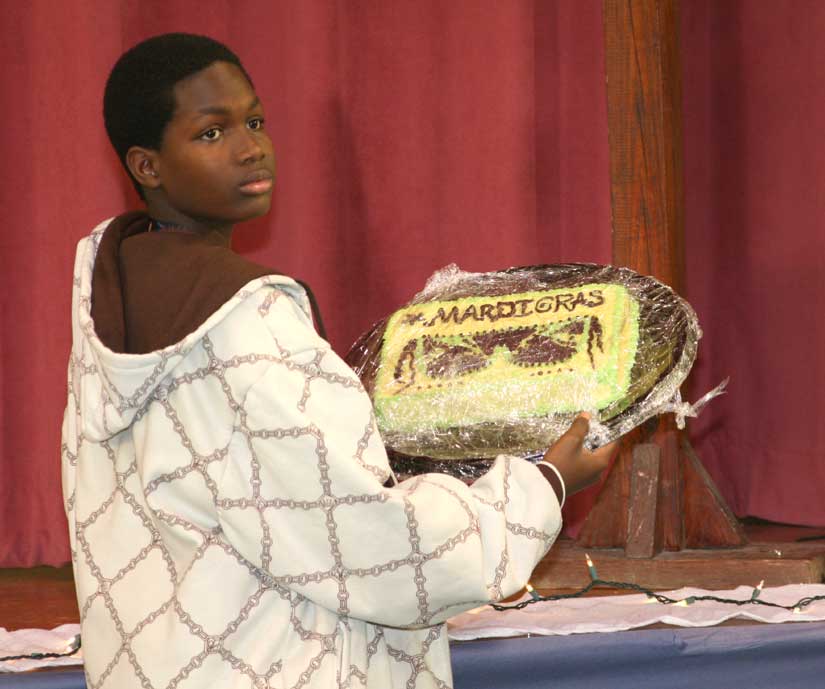 Cake Auction == The Mardi Gras Cake