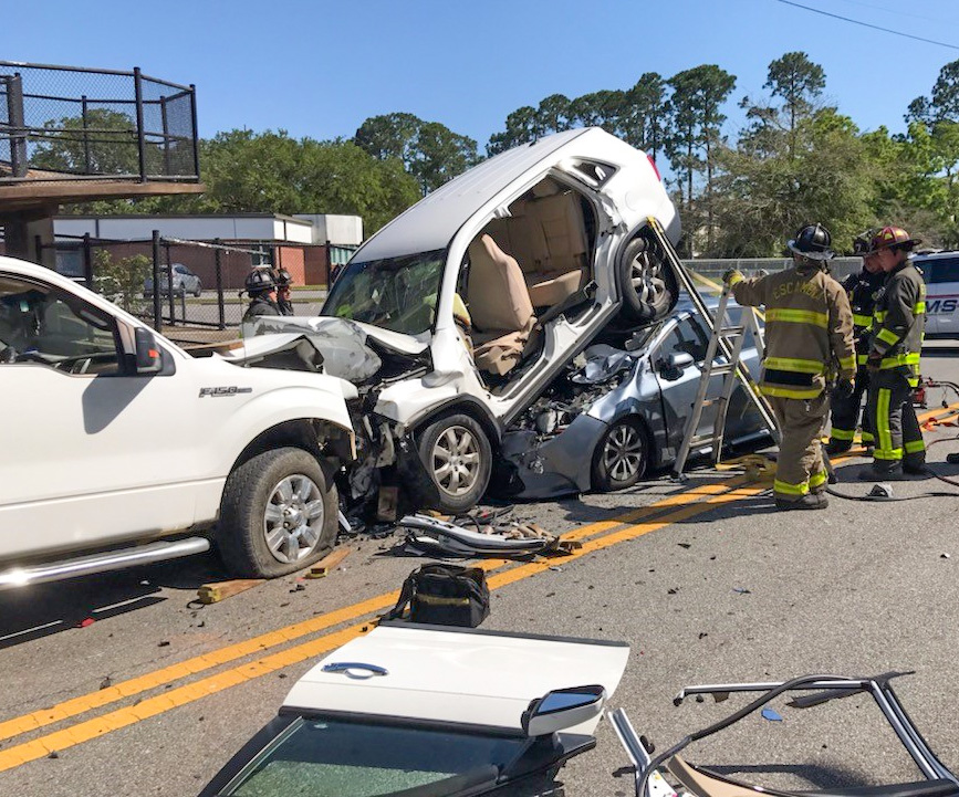 Four Injured In Davis Highway Crash; SUV Ends Up On Top Of Car