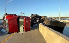 Dump Truck Left Hanging Over Escambia Bay Bridge After Tire Blowout