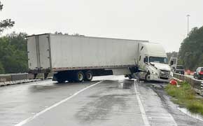 Hydroplaning Semi-Truck Crashes Into Median, Blocking I-10 Westbound