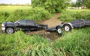 Pickup Hydroplanes During Heavy Thunderstorm, Crashes Into Flooded Ditch