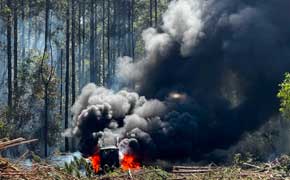 Firefighters Battle Logging Equipment, Brush Fire Deep In Wooded Area Near Walnut Hill