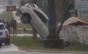 SUV Ends Up Suspended On Power Pole Wires Following Pensacola Boulevard Crash